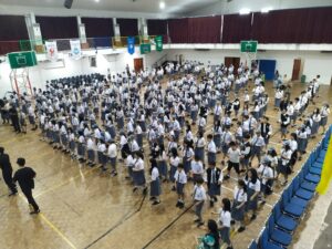Middle school assembly conducted by 9A